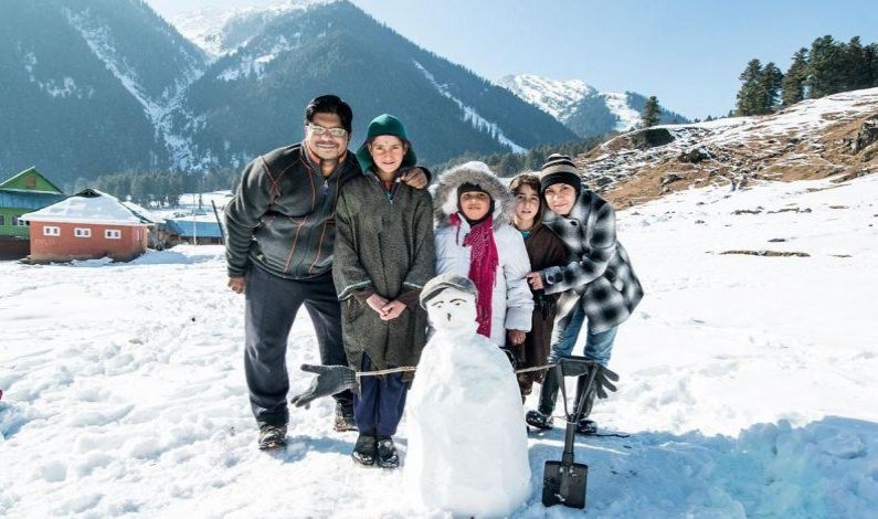Happy family in traditional Kashmiri dress